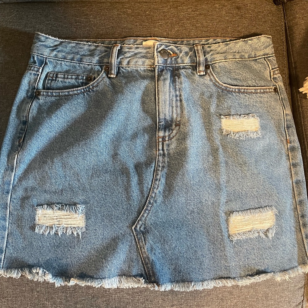 Jean skirt with rips.